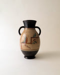 Ceramic vase with black and brown design on a beige background