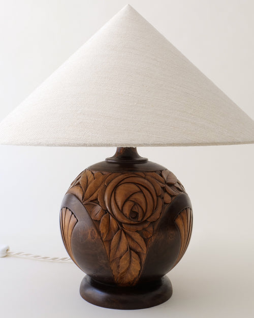  French Art Deco carved walnut table lamp c.1925, spherical base with rose motif and hemp shade, full view unlit