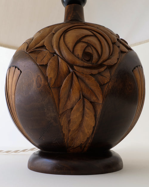 French Art Deco carved walnut lamp, spherical base with carved rose and leaf motif, close-up without shade
