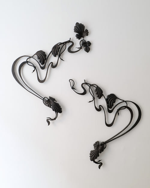 Art Nouveau wrought iron architectural element with flowing floral and leaf motifs early 1900s