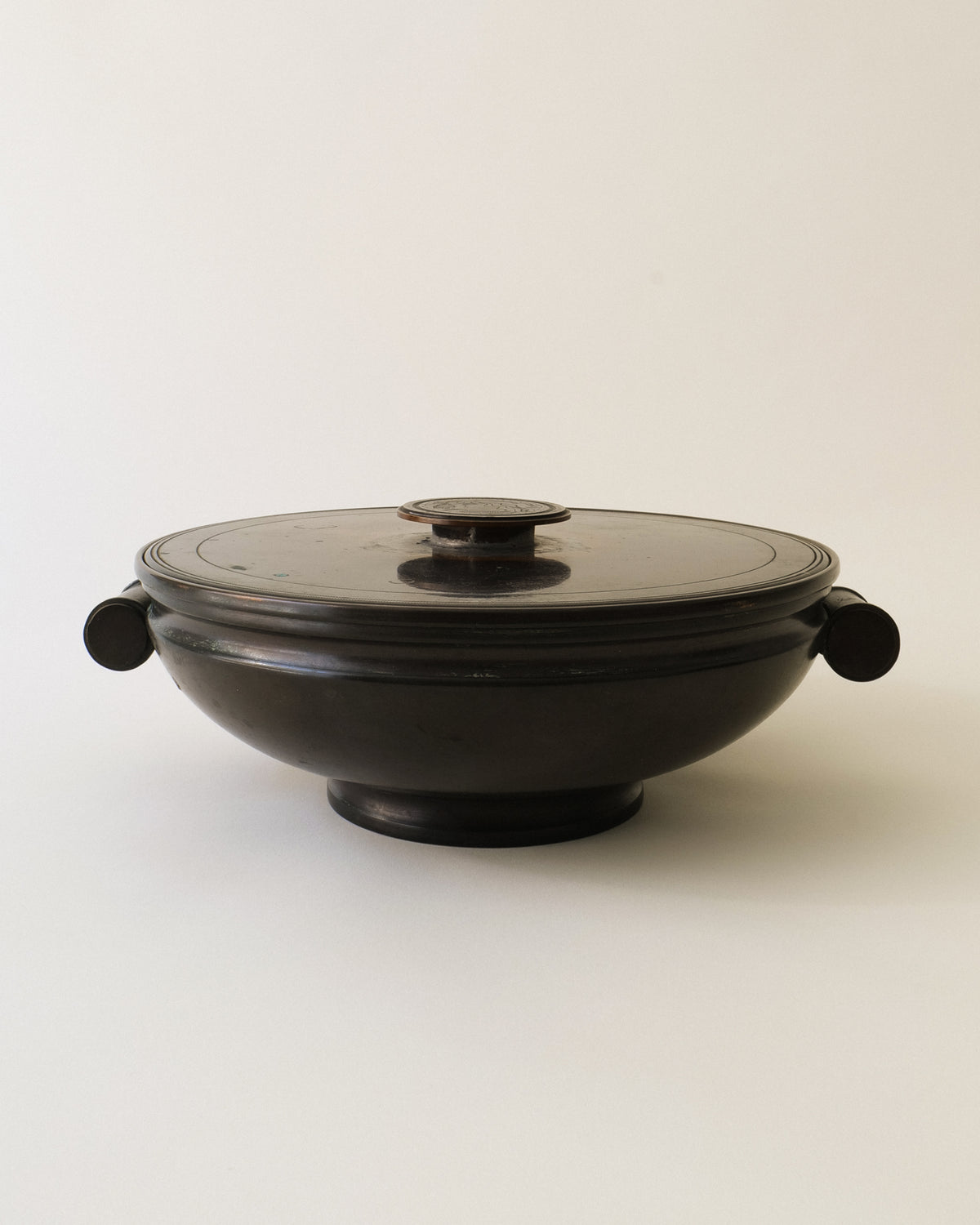 Nilsson & Johansson bronze lidded dish shown from an angled front view
