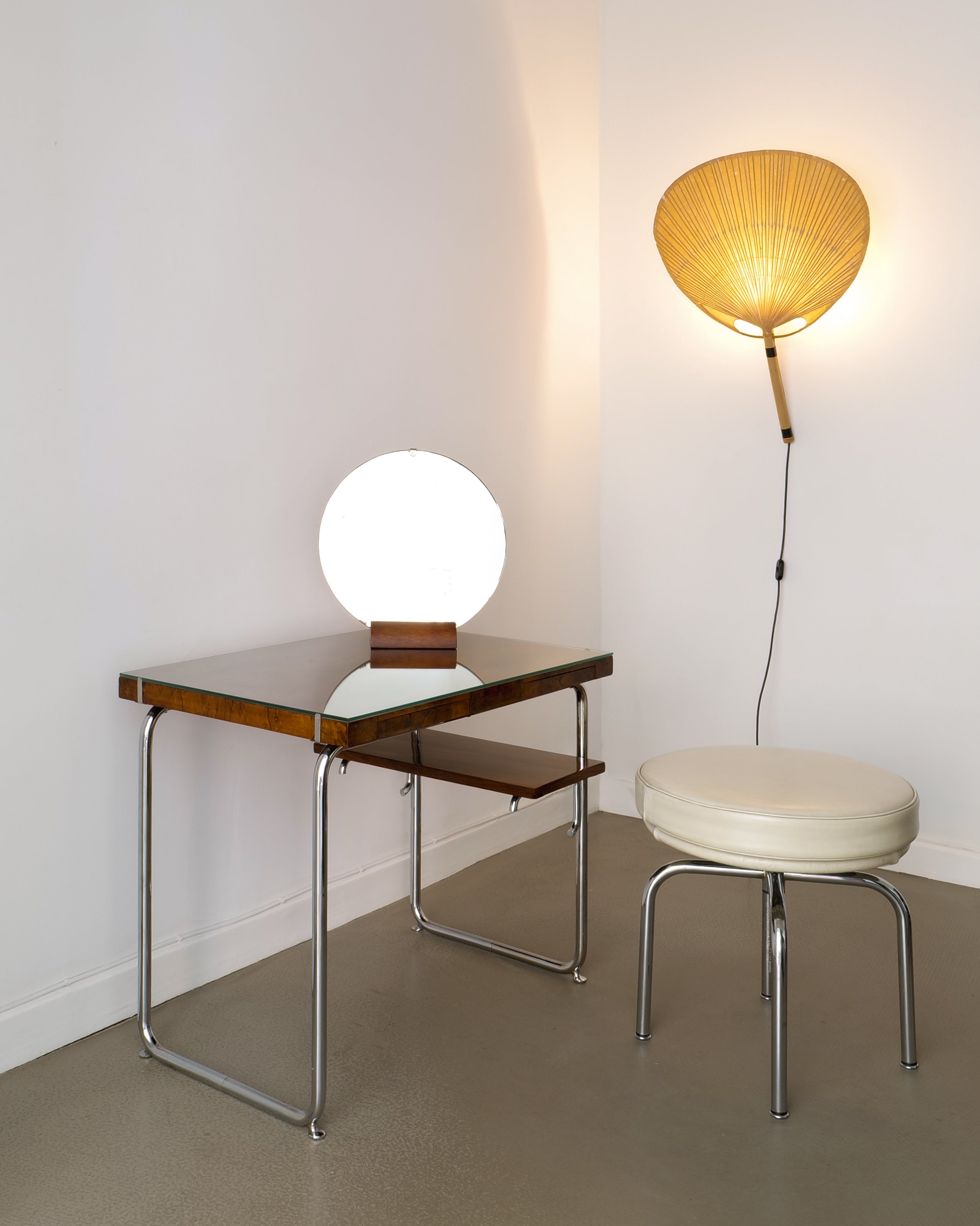 Charlotte Perriand LC8 stool, styled in room with desk and Ingo Maurer wall lamp, Charlotte Perriand  LC8 stool, interior context view