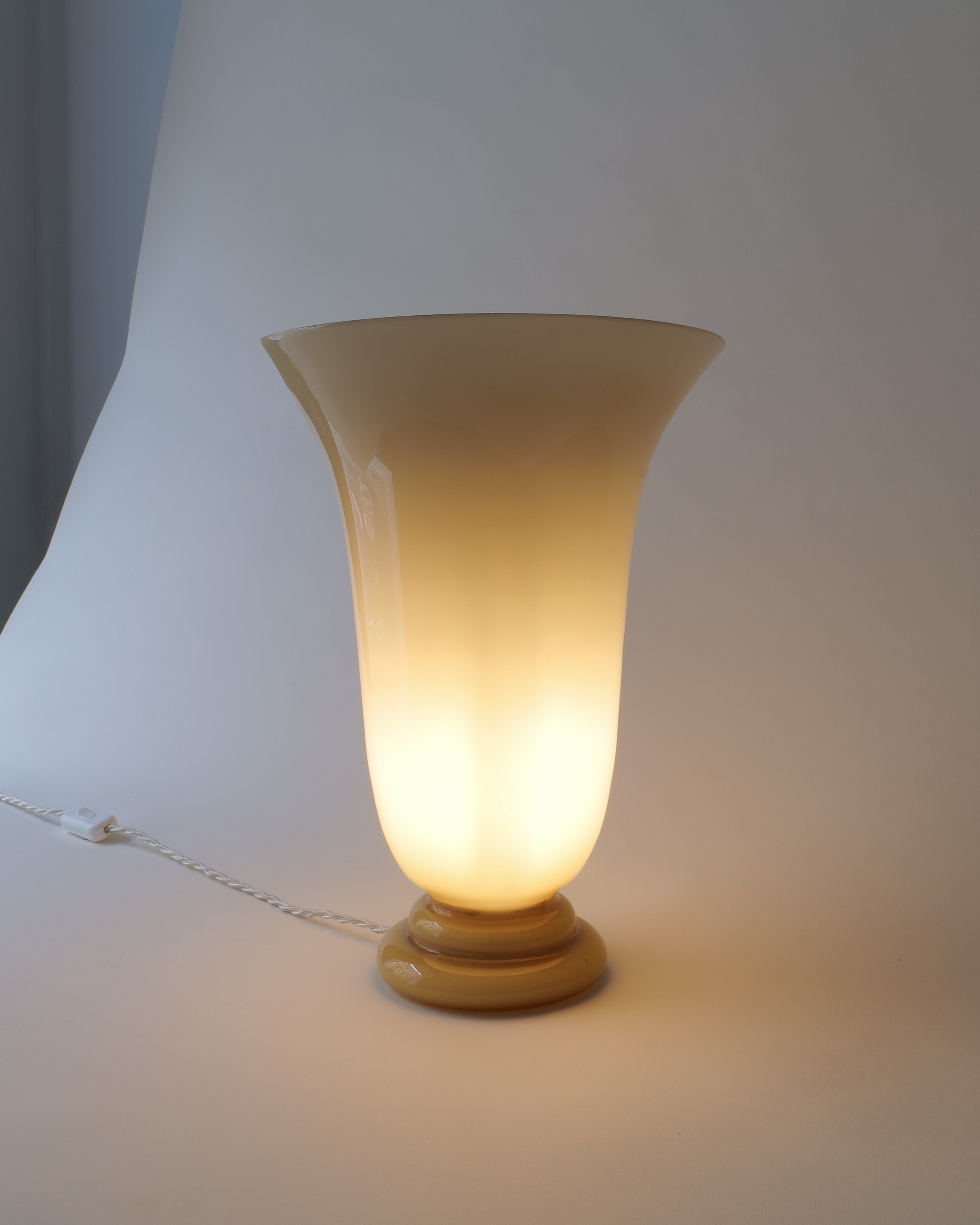 French Art Deco opaline glass table lamp, c.1920s–30s, full view illuminated
