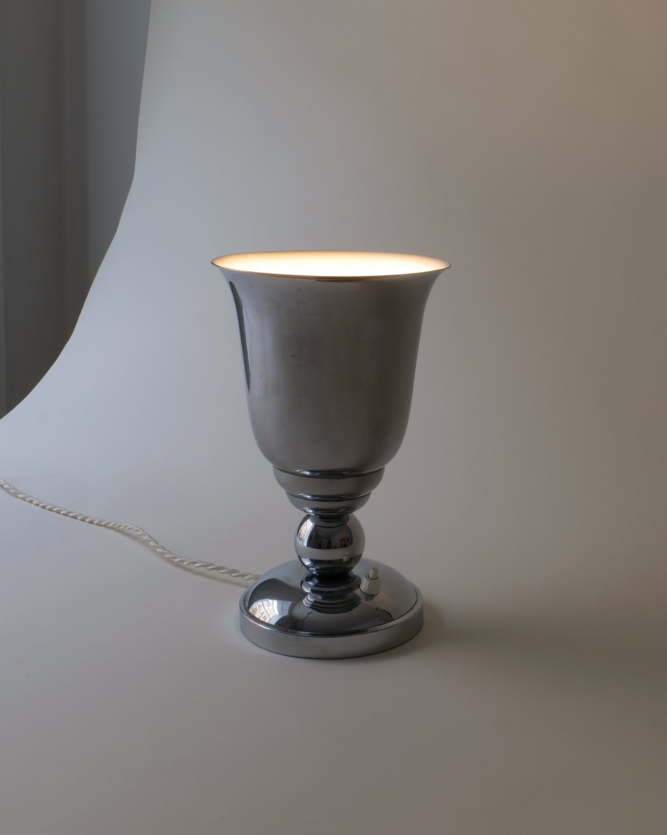 French Art Deco chrome uplighter table lamp, c.1930, full view illuminated