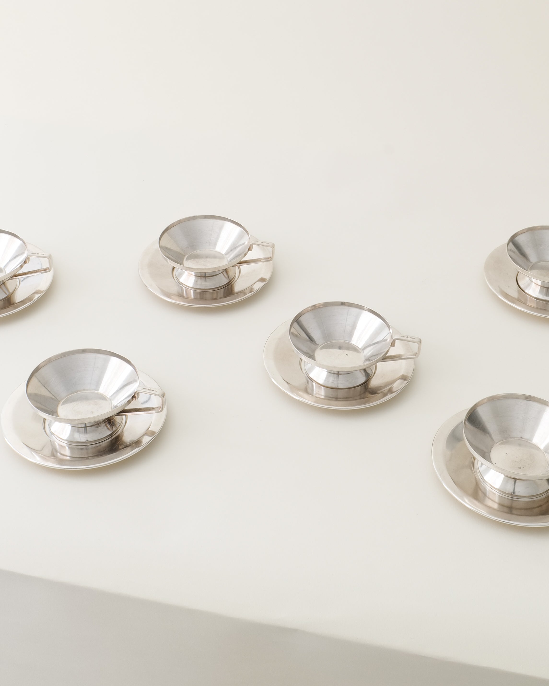 io Ponti Arthur Krupp cups and saucers, full set overhead view, silver-plated surface