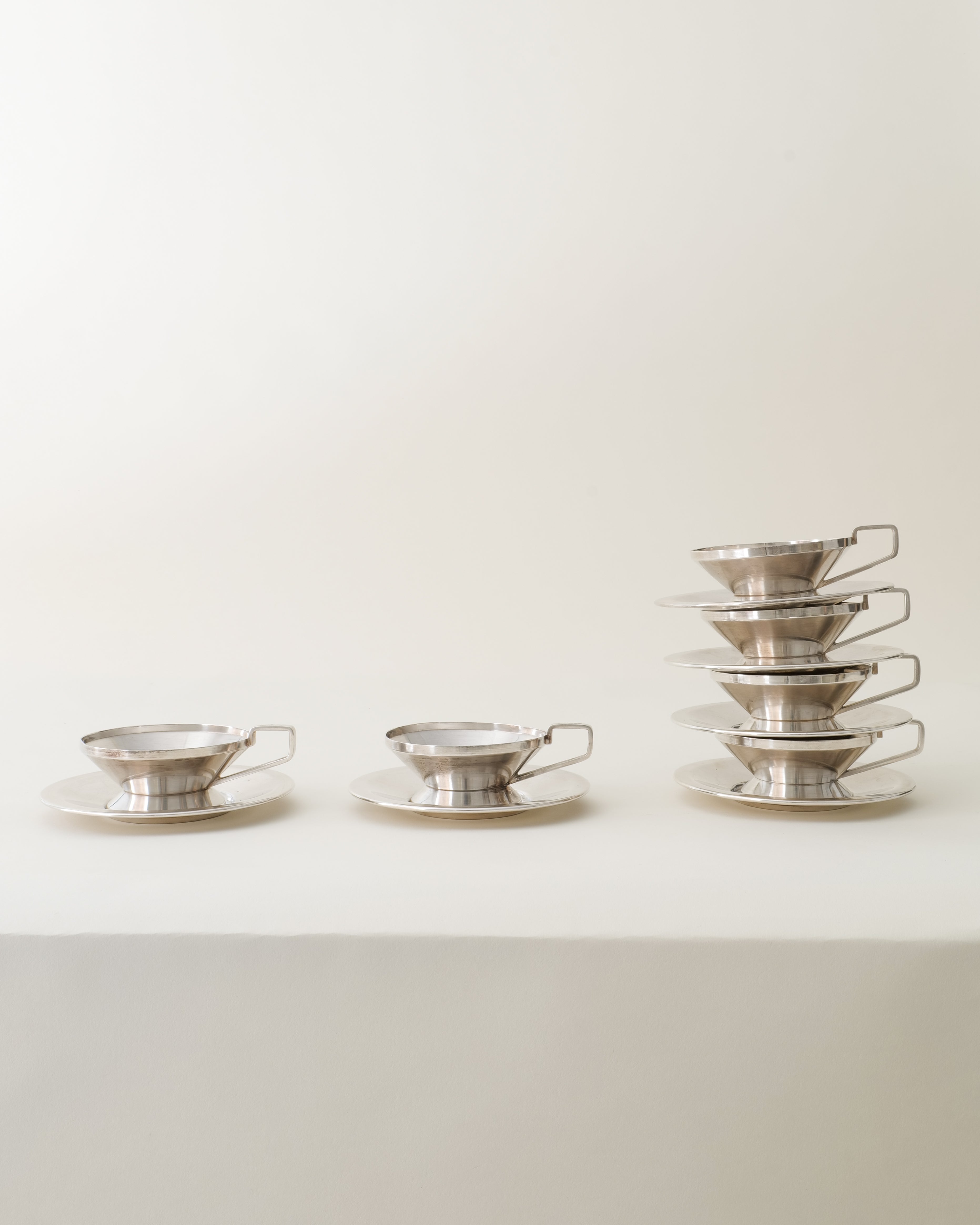 Gio Ponti Arthur Krupp cups and saucers, set grouped from side, architectural form detail