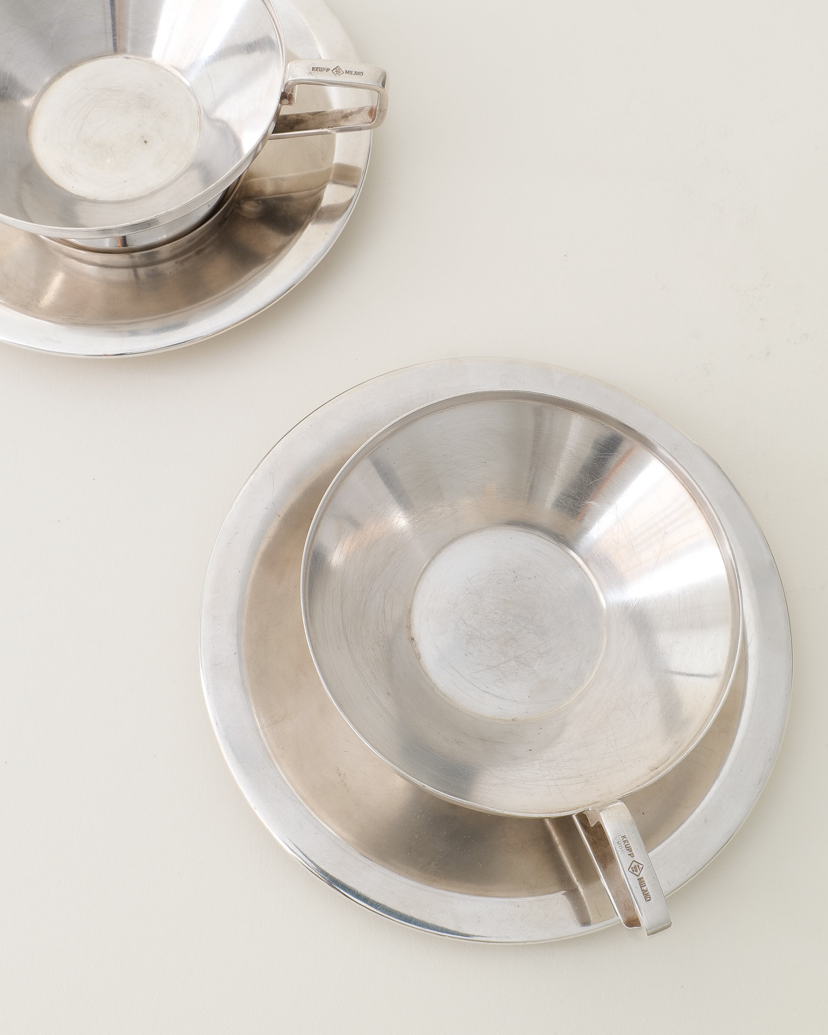 Gio Ponti Arthur Krupp cups and saucers, top view of cup handle with stamp detail