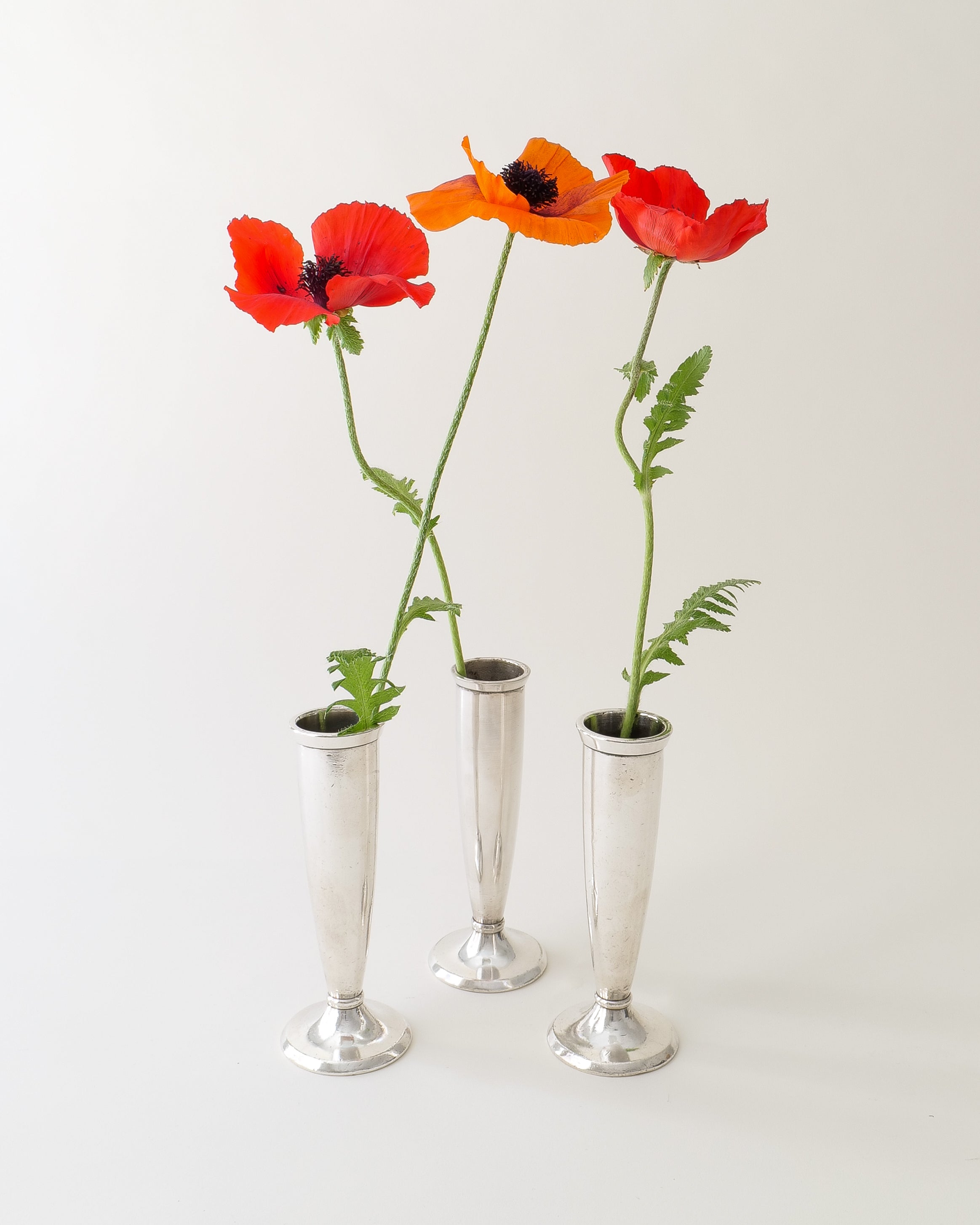 Gio Ponti silver-plated soliflore vases for Arthur Krupp Milano 1950s, set of three with red poppies, full view
