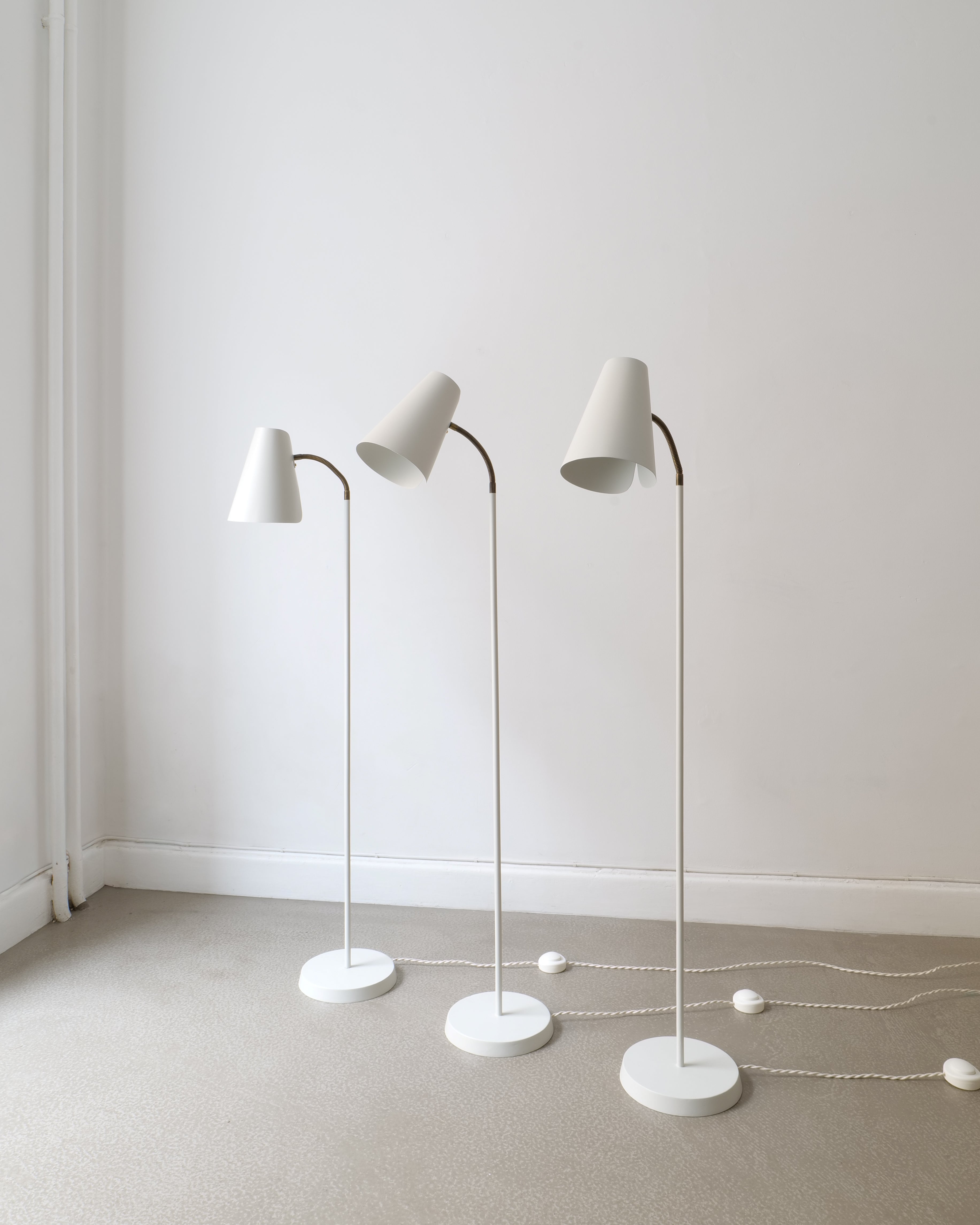 Aet of three Harald Notini Model 225 floor lamp sby Böhlmarks, full view, matt Grey White re-lacquered body, 1930s–40s