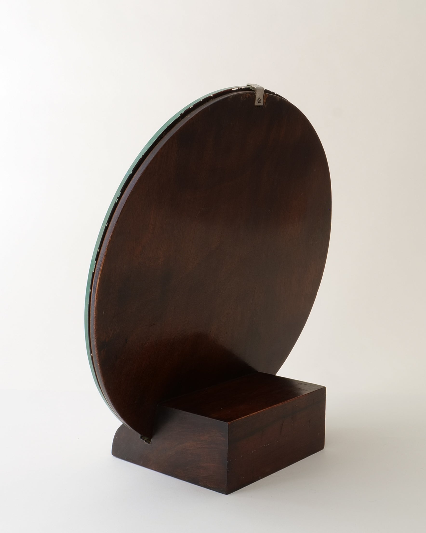 Italian Art Deco table mirror, three-quarter rear angle showing walnut base and disc