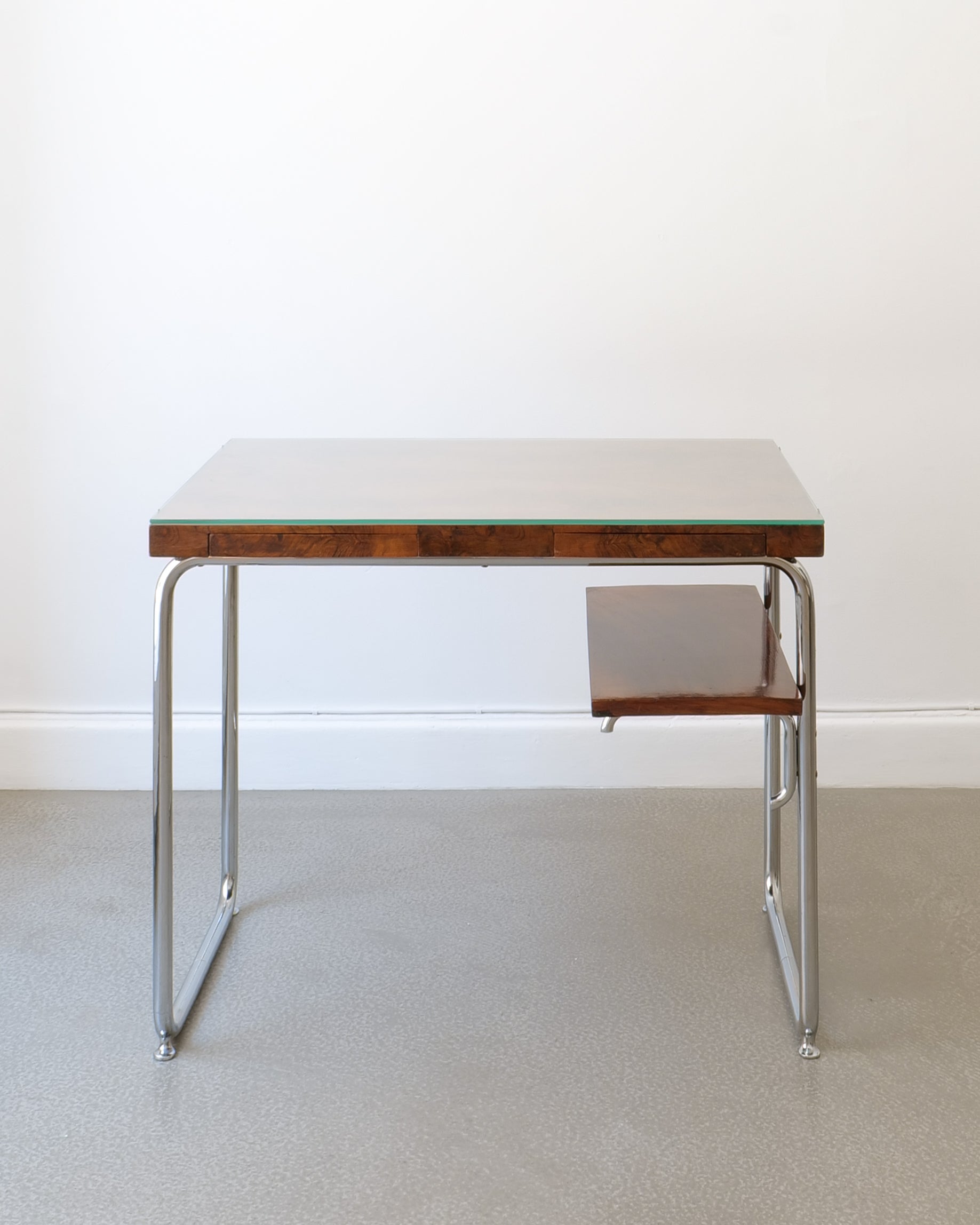Italian Rationalist dressing table, walnut drawer and chrome frame, front-right view