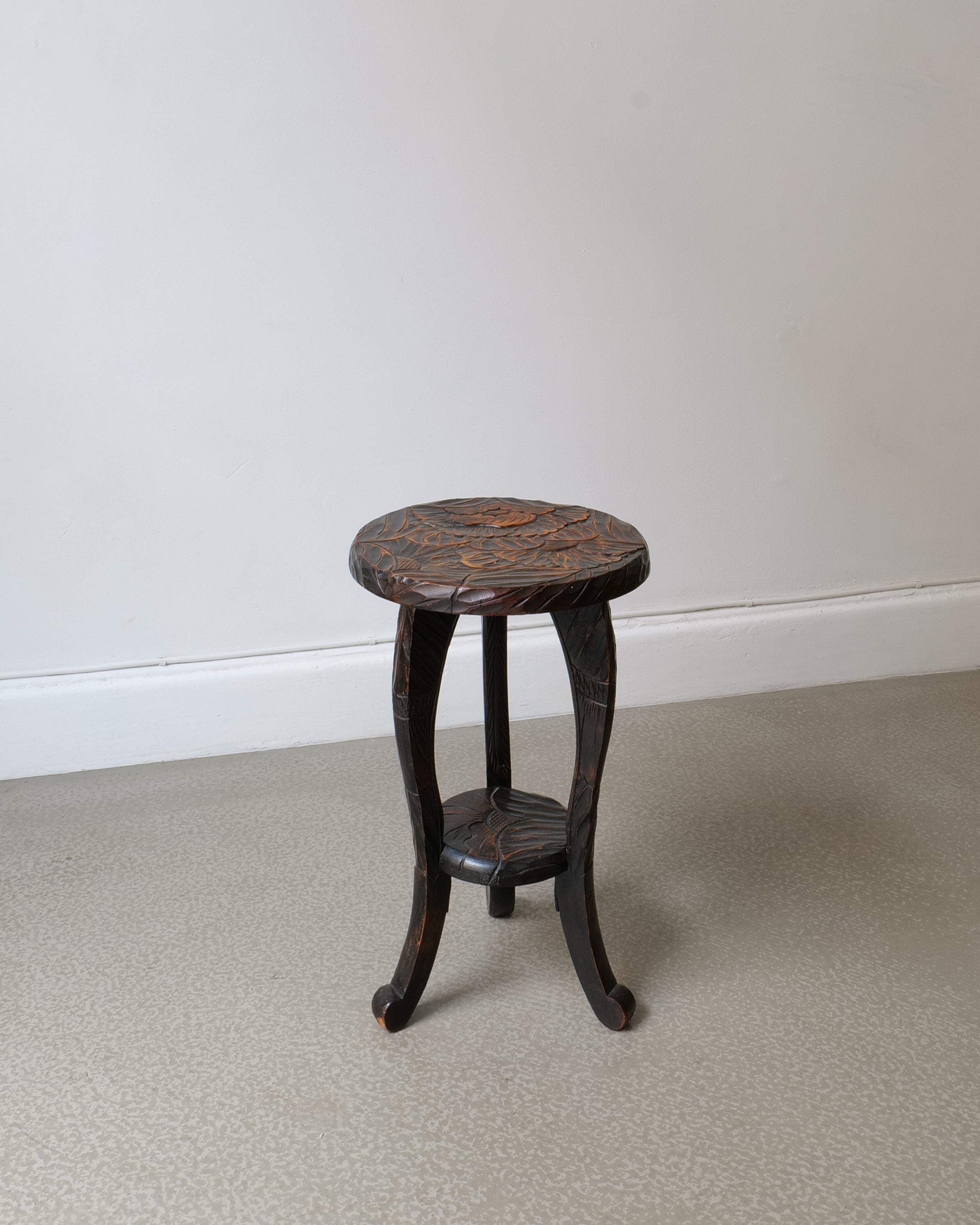 Japanese carved hardwood side table made for Liberty & Co c.1900s, ebonised finish with peony and foliage decoration