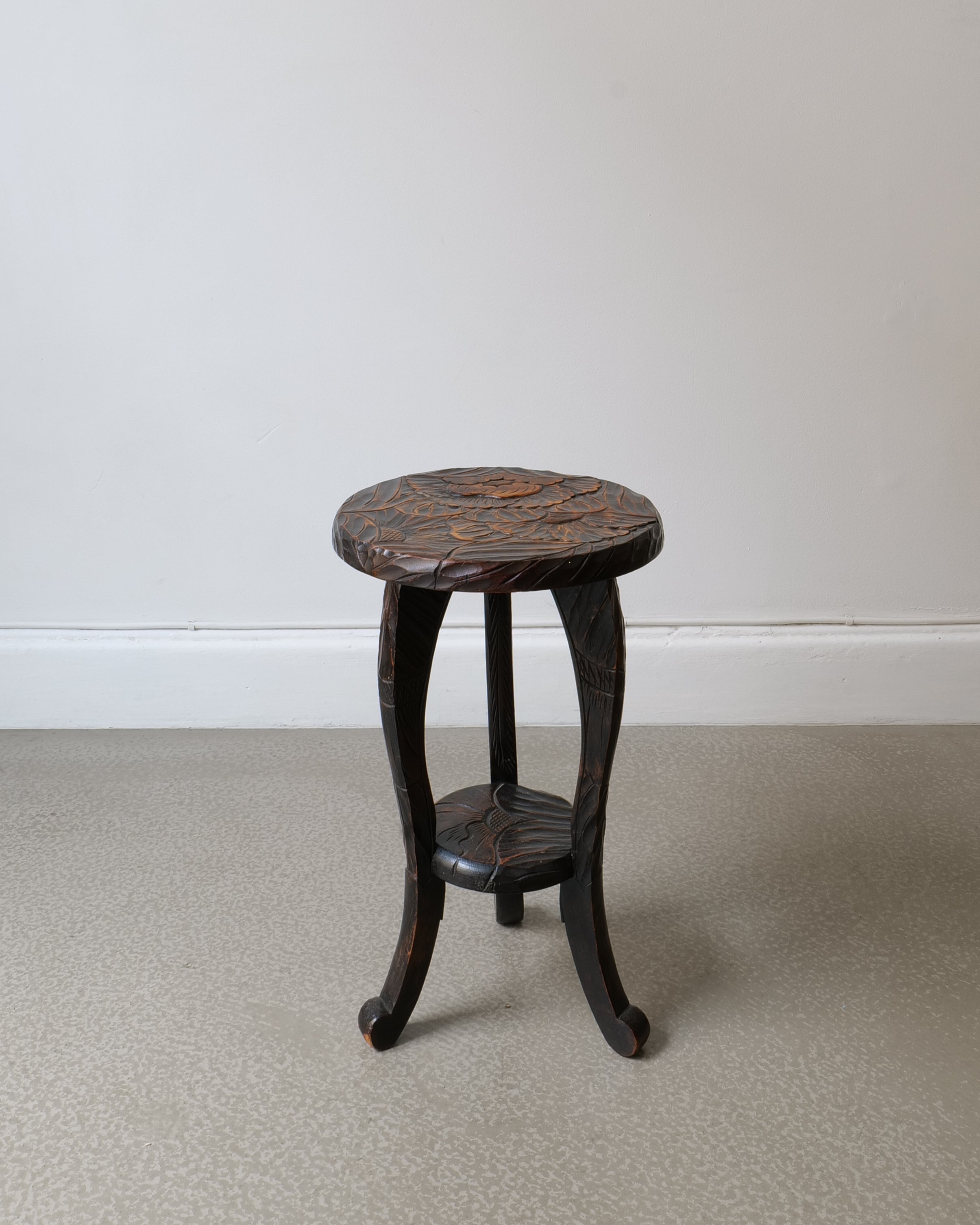Japanese carved hardwood side table made for Liberty & Co c.1900s, ebonised finish with peony and foliage decoration