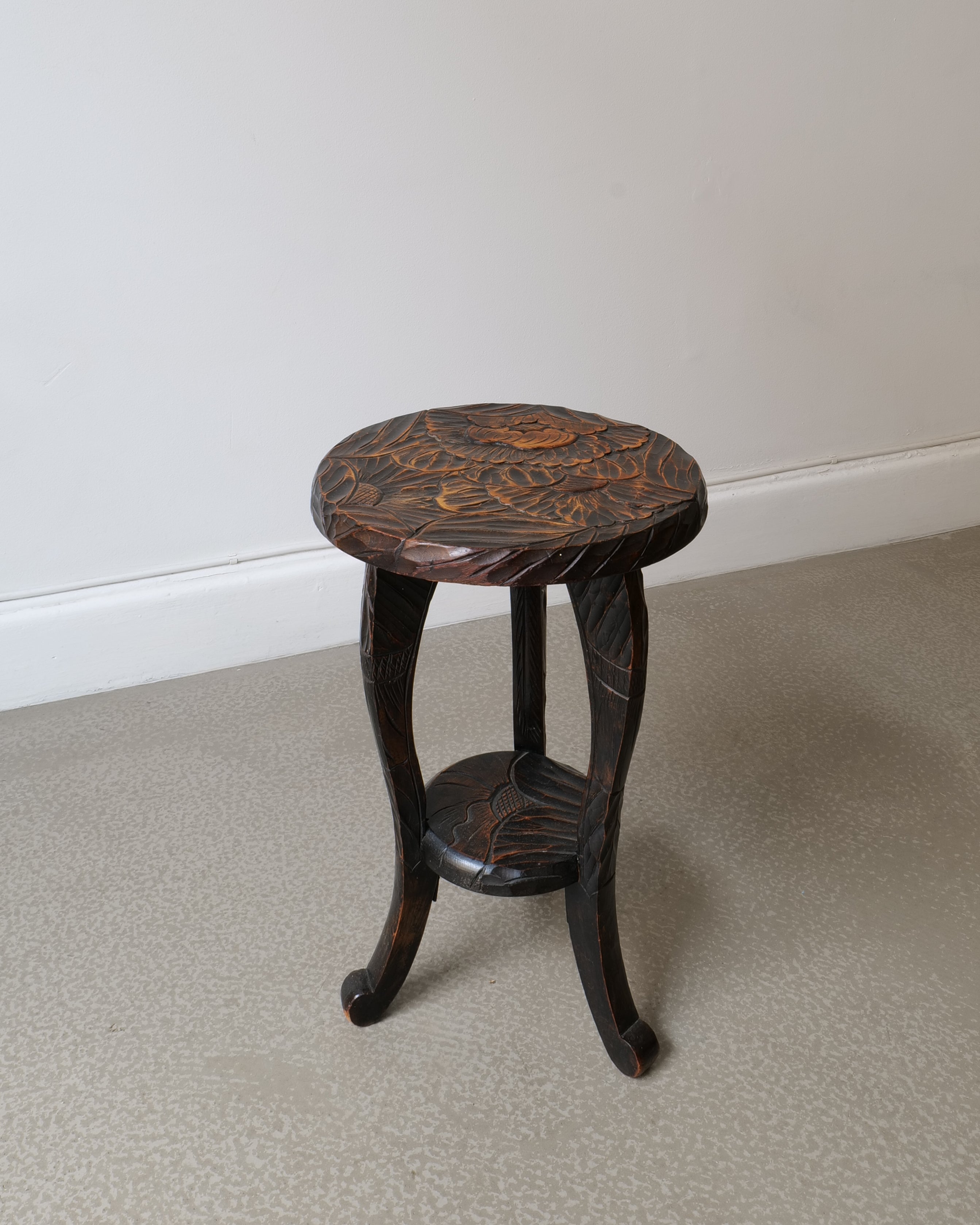 Lower shelf and cabriole legs of Japanese Liberty & Co side table with carved pad feet