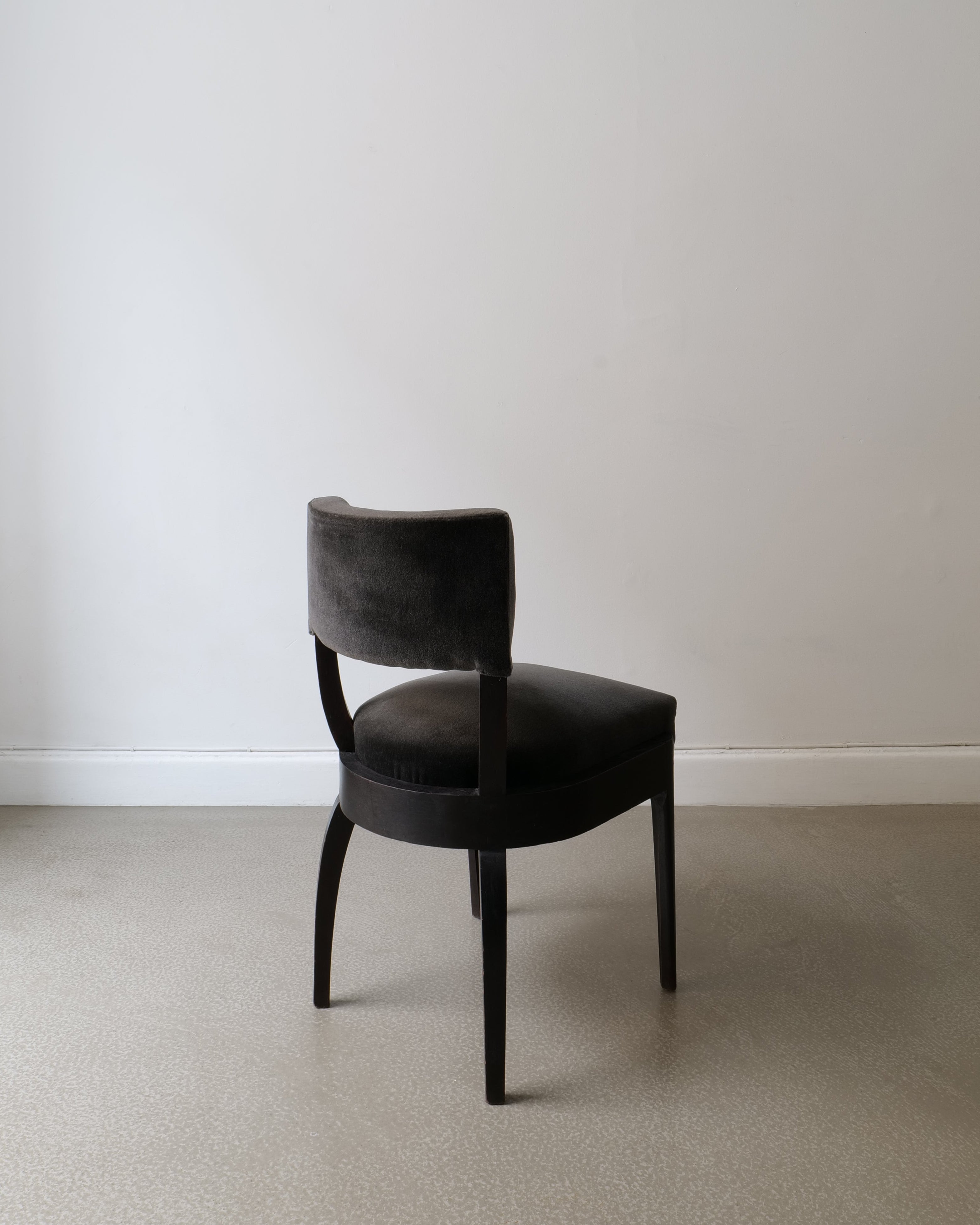 Back view of René Prou ebonised wood side chair with rounded back