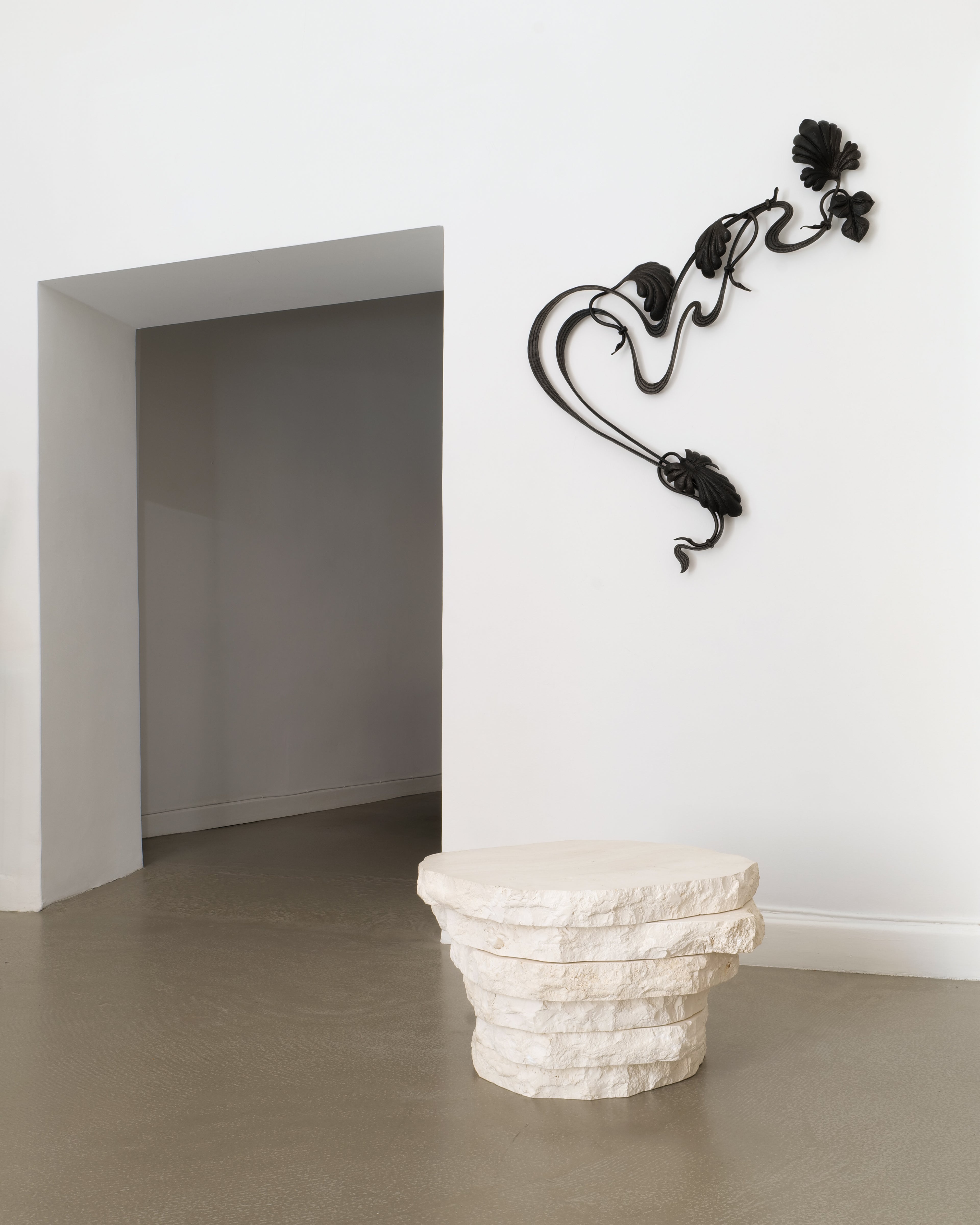 Table, 2025, Jesper Sundberg Örtegren, installed in gallery with wall-mounted sculpture, context view
