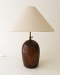 French 1930s table lamp with rounded dark wood base and tapered white shade
