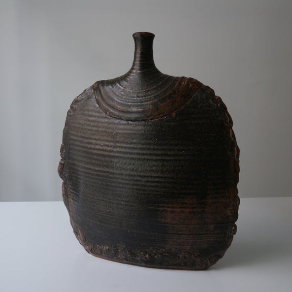 Swiss, ceramic, grand, floor vase, disc shapes, small spout, brown, black, textured glaze