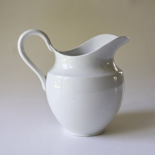 ceramic, pitcher, jug, exaggerated, lip, handle, white, glaze